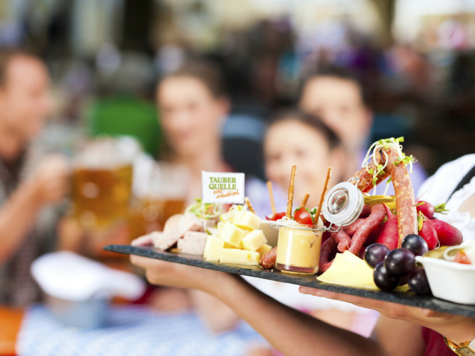 Beer garden restaurant in Bavaria, Germany - beer and snacks are served, focus on meal